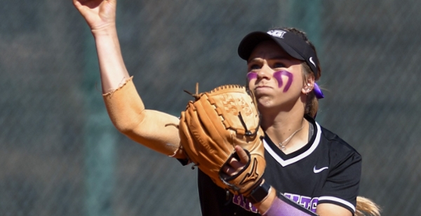 Knights softball player throws the ball during a game.